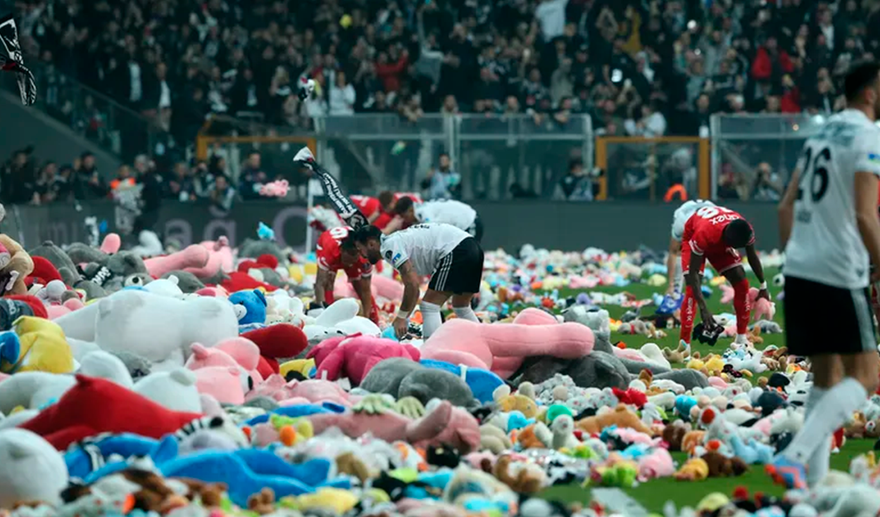 Rain of stuffed animals on the soccer field as a tribute to children in