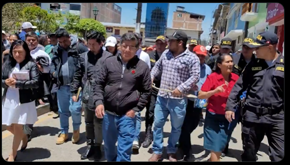 With whip in hand, citizens of Chota force a congressman to march alongside them: "So that you know the square"