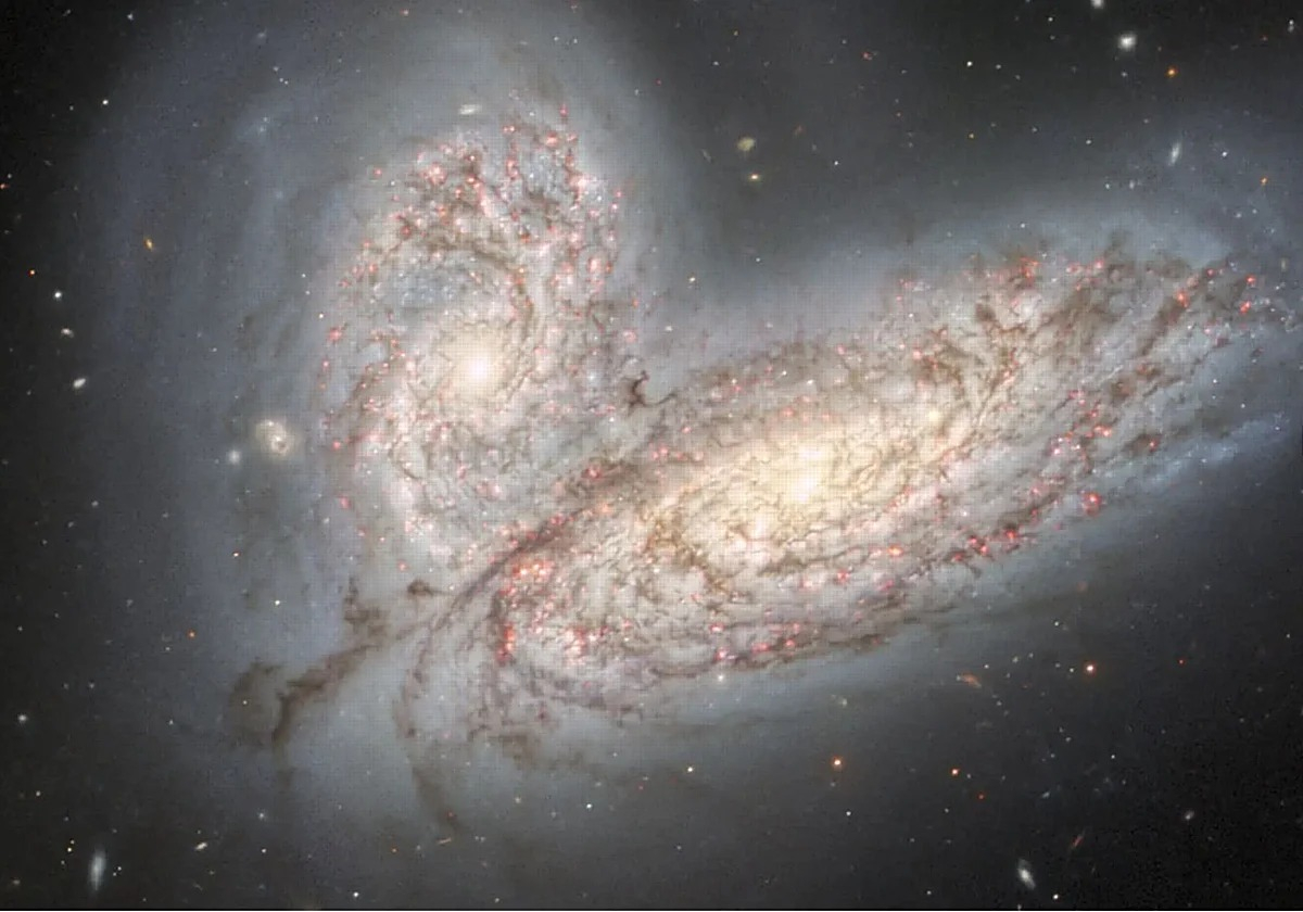Las galaxias NGC 4567 y 4568 se fusionan en un proceso idéntico al que vivió la Vía Láctea hace 11 000 millones de años. Foto: Gemini/NOIRLab